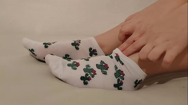Girl taking off her socks