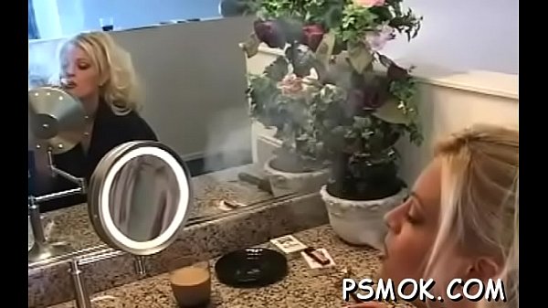 Beauties sharing a cigarette while giving a sloppy irrumation