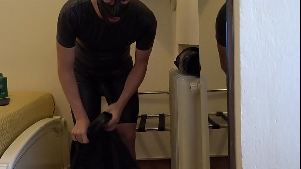 Download Video - Wearing a black latex female S-size catsuit