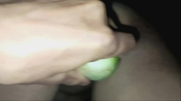 Teasing the pussy hole with a cucumber, the mistress stuffs it in the pussy, then spreads the student girl's pussy and uses the cock to fuck the clit.