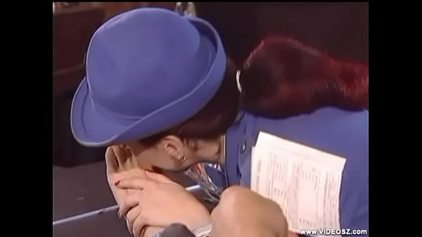 Female traffic cop licks male feet