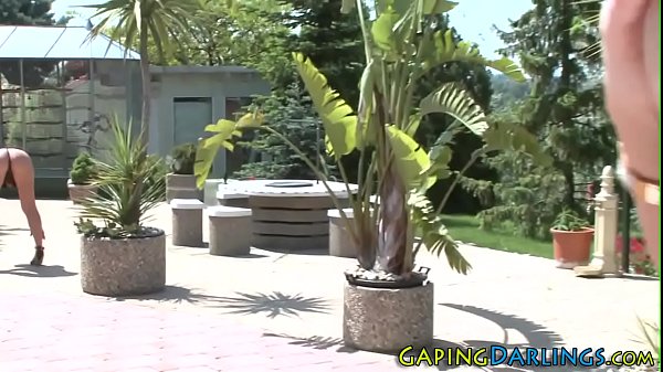 Anally toyed lesbian fingers outdoors