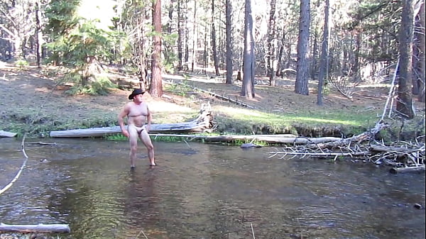 Bathing naked in the creek.