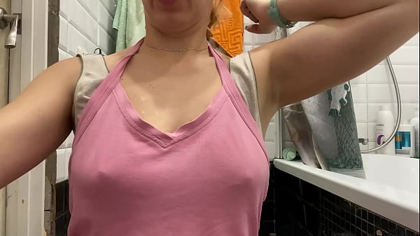 Strong woman shows her muscles and armpits