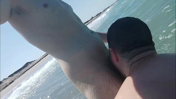 Sex in the beach with waves