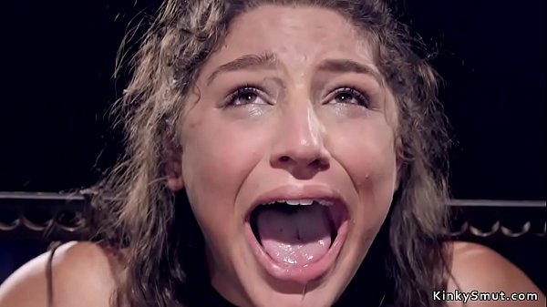 Brunette beauty in metal device bondage