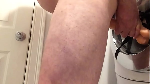 Clothes dryer helps bi guy ride a big dildo