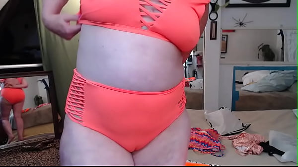 851 I put on and take off several bathing suits with teasing and flirting in betweem