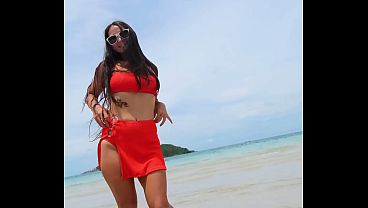 Orange bikini fun and beauty flashing on the beach