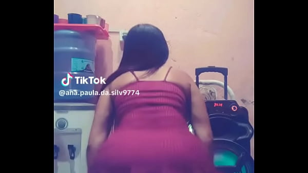 A hot girl dancing in a dress.