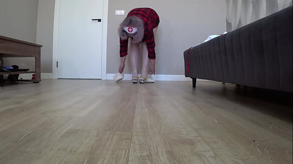 Home camera watches plump legs from below on the floor. Mature housewife changes into a sexy nurse uniform. Foot fetish.