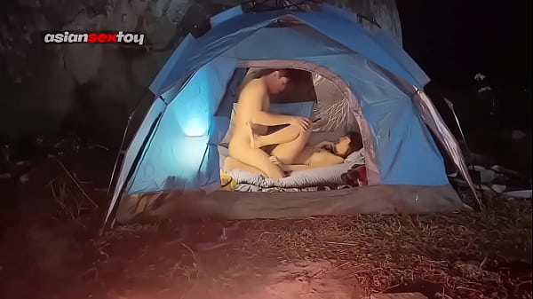 Asian teens have romantic sex in a tent while others are sleeping