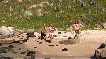 Beautiful blonde is the attraction of the beach and three guys who fuck her in group