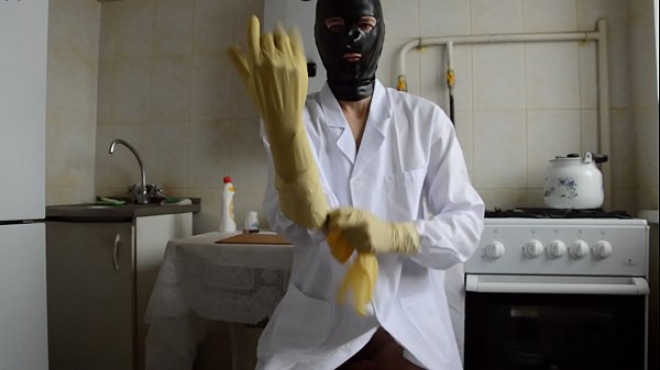 Download Video - guy in the medical gown puts on three layers of gloves