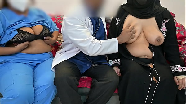Doctor having fun with patient while nurse watch