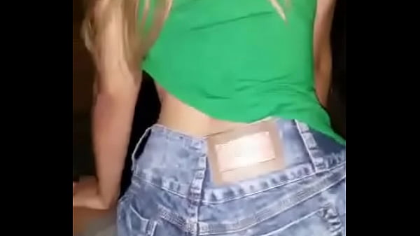 Young horny hot chick sits on the cassette in denim shorts