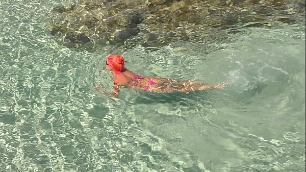 Pink bikini in a beautiful bay