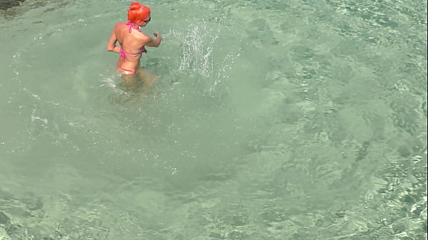 Pink bikini in a beautiful bay