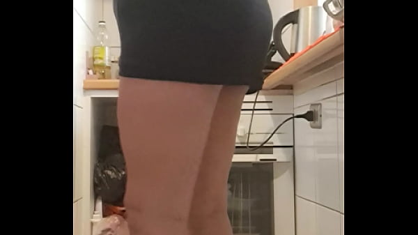 in the kitchen in heels