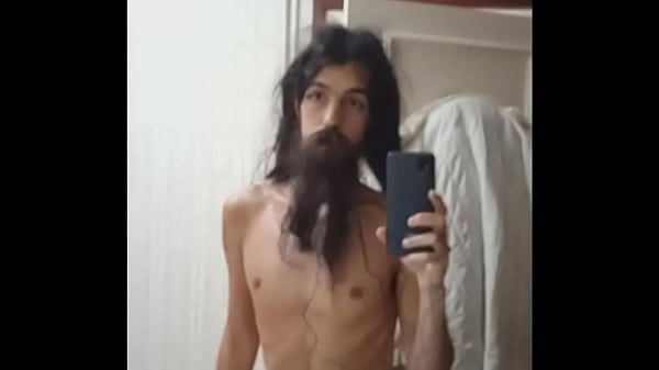 Bearded crossdresser masturbating while watchin...