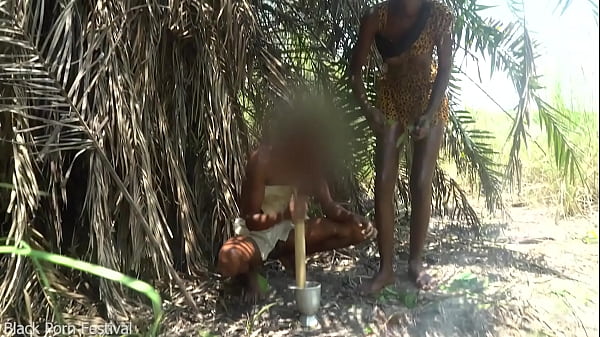 2 African tribe girls jerking off their chief with their asses in the river
