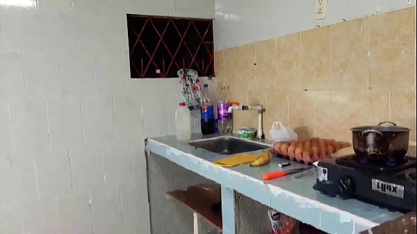 Big ass girl fucks in the kitchen with a young inexperienced guy