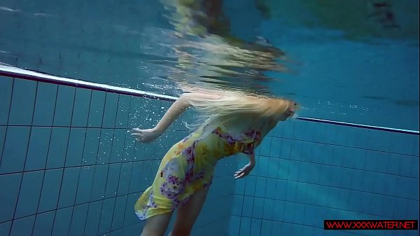 Blonde in a dress in a pool