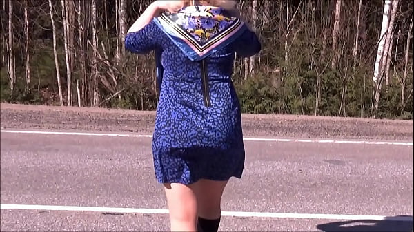 Milf in a short dress on the road