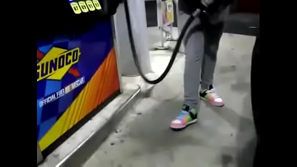 desperate girl wetting pee jeans while pumping gas
