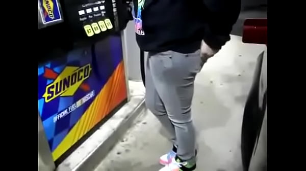desperate girl wetting pee jeans while pumping gas