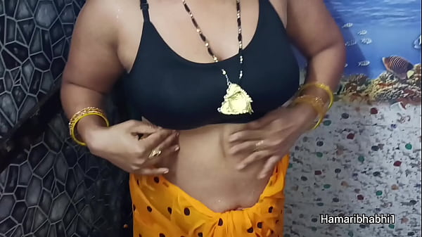 Indian Desi Bhabhi Bathing And Removing Her sexy saree.