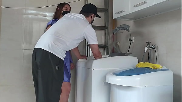Housewife teasing the technician who came to fix the washing machine