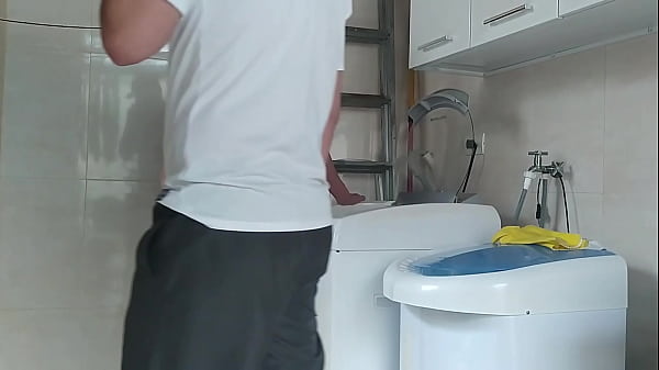 Housewife teasing the technician who came to fix the washing machine