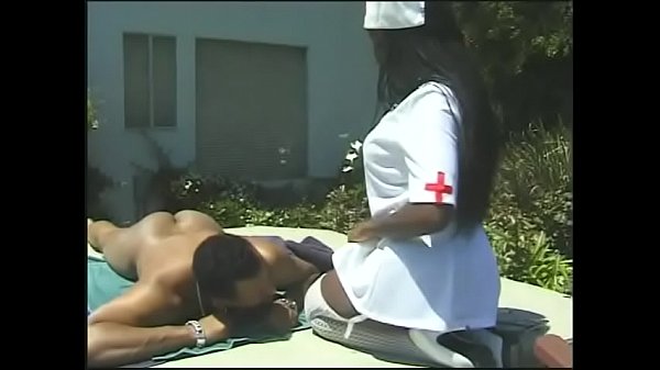 Nurse in white stockings seduces black dude sunbathing by the pool to fuck her