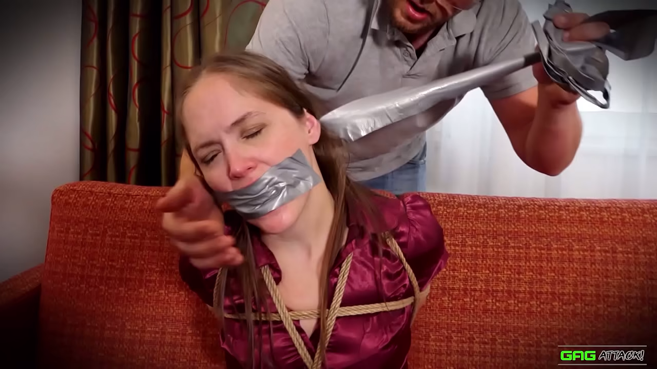 Rachel Adams - Secretaria atada y amordazada con cinta adhesiva, vestida con una blusa.
                    bdsm cute bondage tied bound ballgagged girl next door tape bondage damsel in distress tape gagged gag talk bound gagged tied up girl tied up gagged gefesselt geknebelt muchos negros
