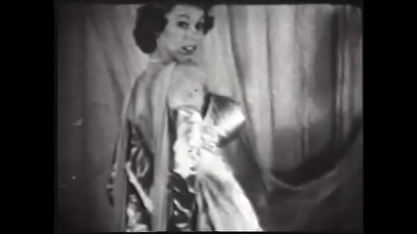 Busty Scheherazade dances erotically on stage and takes off her oriental outfit