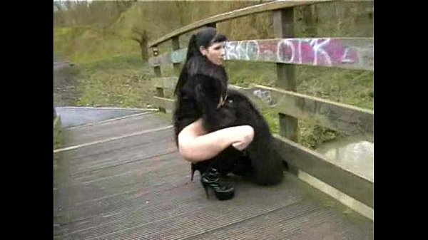 Goth Babe in Furry Coat Pisses Outdoors 1