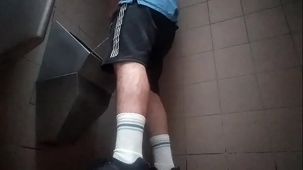 Download Video - Young guy peeing in a public toilet