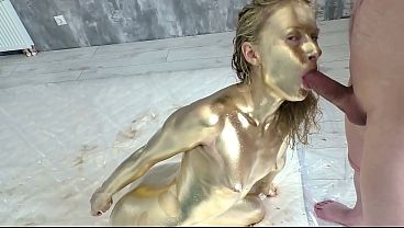 Pretty woman makes herself a golden body art, then gently fucks and sucks a dick, filled the whole body art with sperm