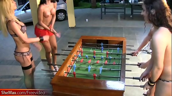 Download Video - T-girls strip down lingerie and stockings playing foosball