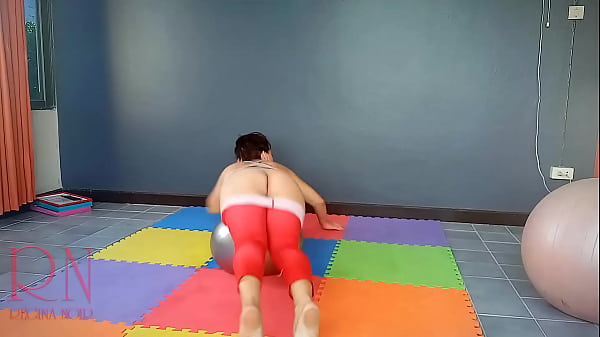Nude Yoga. Regina Noir. A woman in yoga leotards practices yoga in the gym.  c1