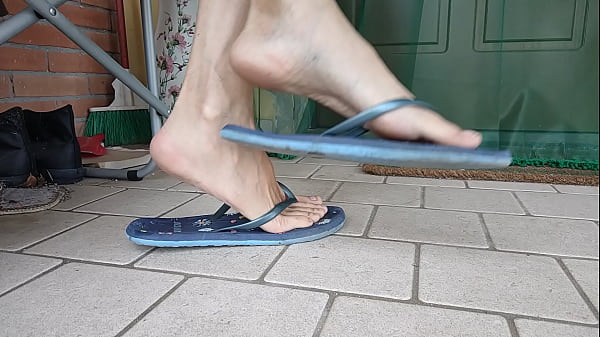 Dangling and shoeplay with female flip flops an...