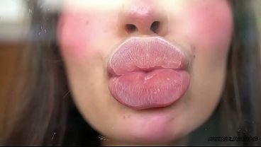 Pillow-soft Glossed Lips in a Melting Sensual Kiss