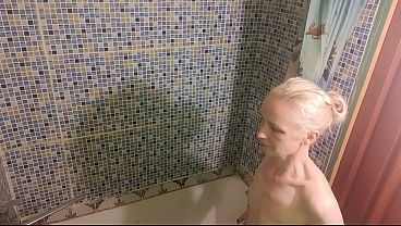A short guy licks and fucks a much taller, skinny, mature amateur in the bathroom