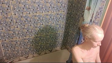 A short guy licks and fucks a much taller, skinny, mature amateur in the bathroom
