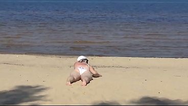 Nimble mature mommy has fun with young guys on the beach 2