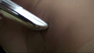 The bored office worker masturbates with a vibrator through her pantyhose while smoking lasciviously.