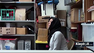 Hijab thief bends over desk so security won't call cops