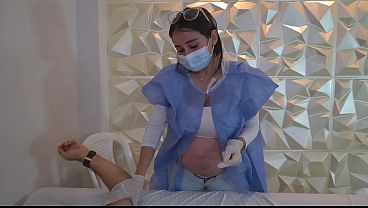 Pregnant doctor treats dark-haired boy, has sex with him, and he pees in his pants