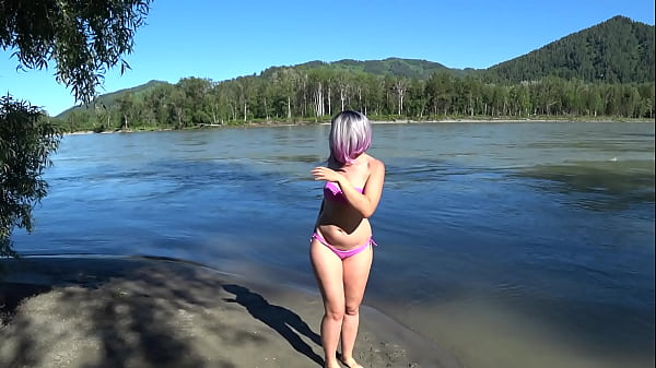 Lesbians rest and fuck on the river bank. Girlfriend with a hairy pussy in a swimsuit doggystyle shakes a big butt. POV Outdoors.
